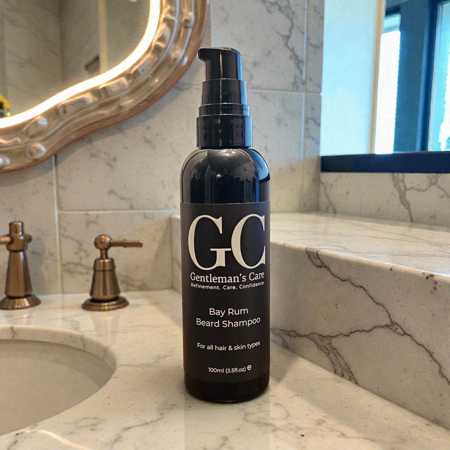 Bottle of 'Gentleman's Care' Bay Rum Beard Shampoo on a marble bathroom counter.